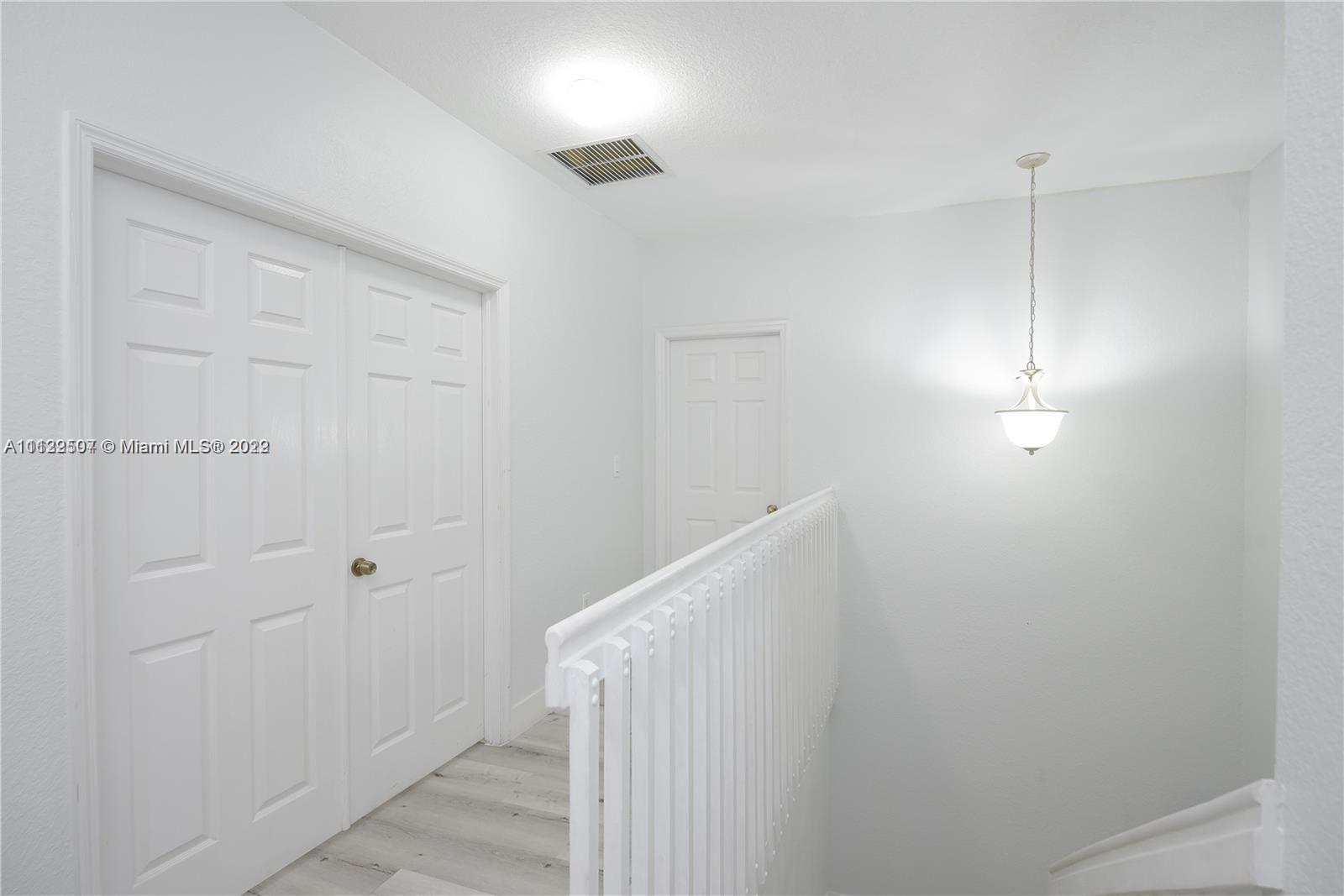 24221 Southwest 112th Court Homestead, FL 33032 - Photo 13 of 25 a view of a hallway