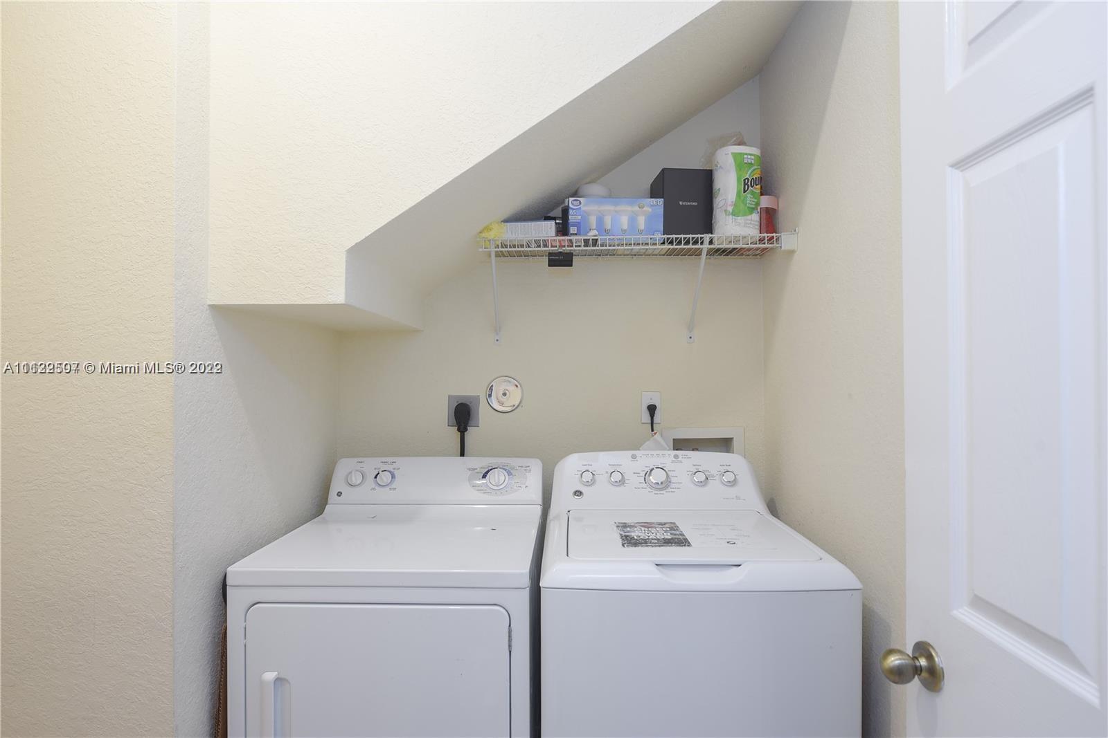 24221 Southwest 112th Court Homestead, FL 33032 - Photo 22 of 25 a utility room with dryer and washer