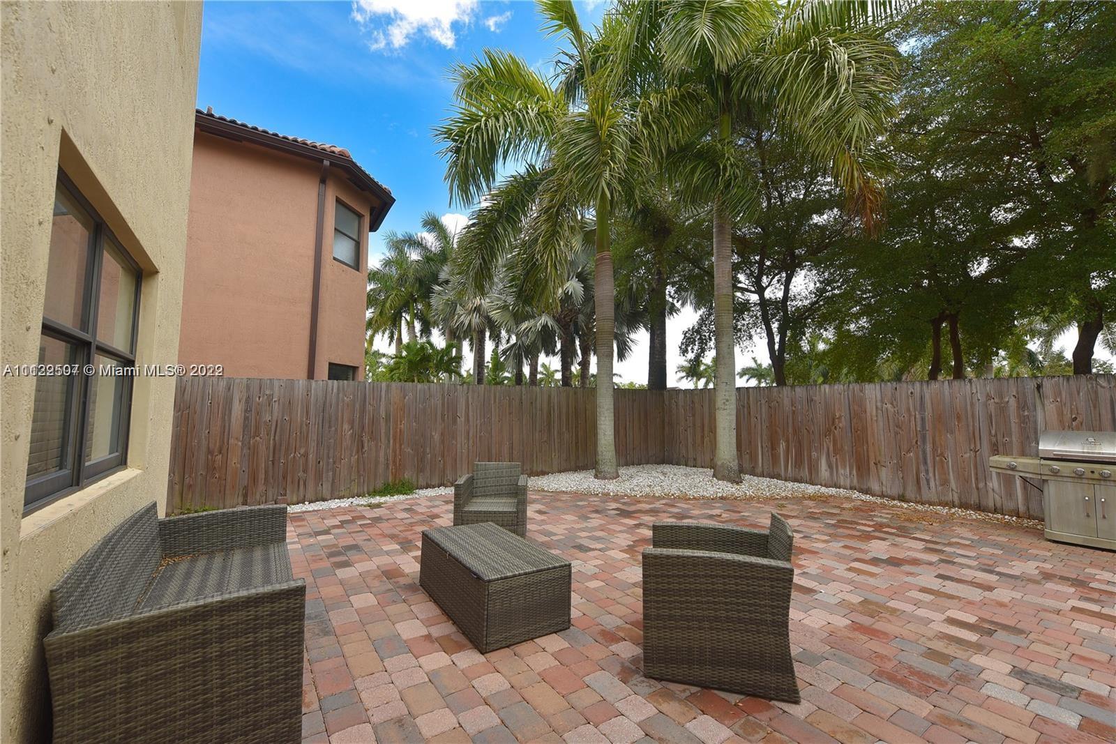 24221 Southwest 112th Court Homestead, FL 33032 - Photo 24 of 25 a view of a backyard with furniture