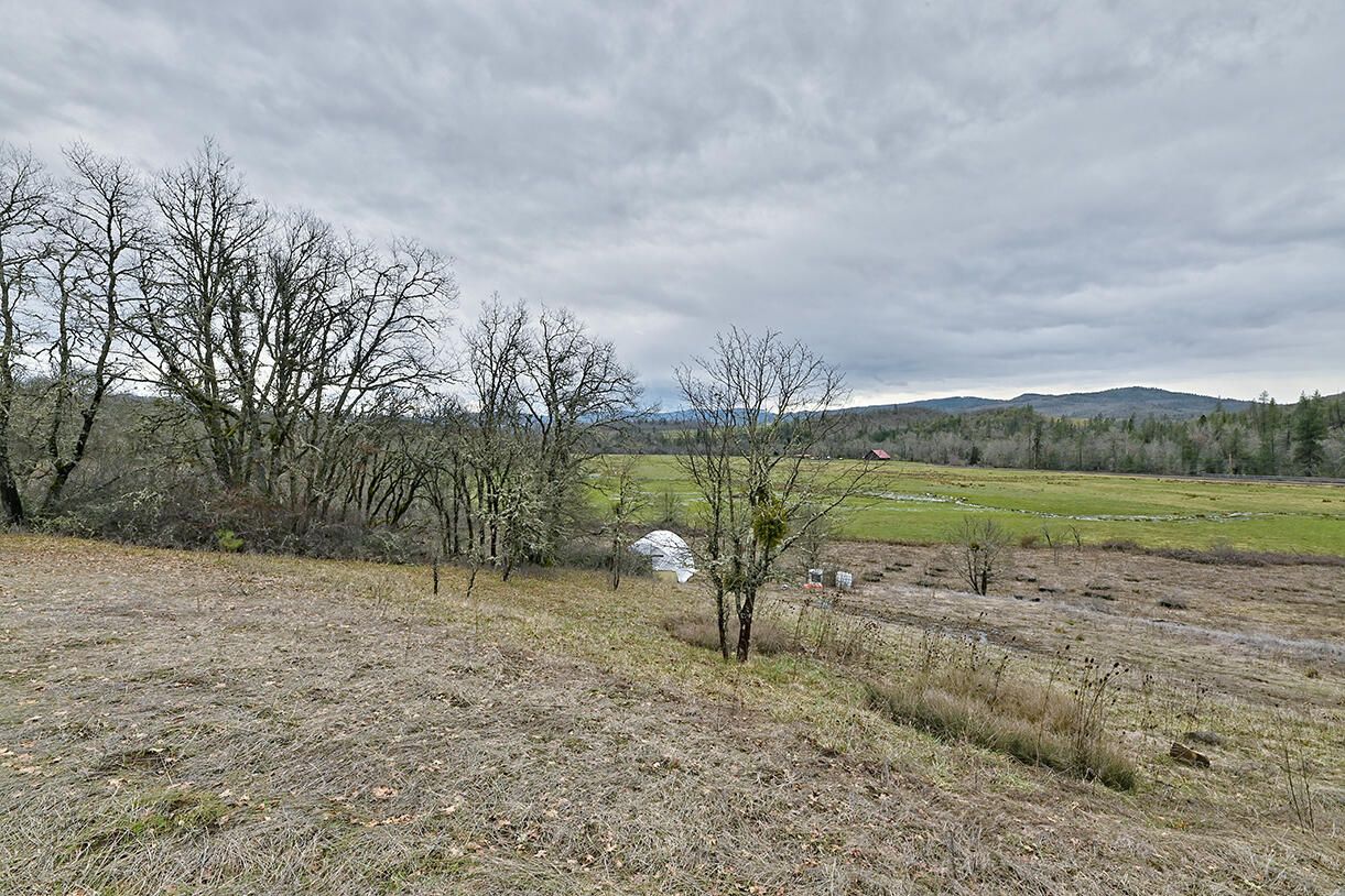 13546 Highway 140 Eagle Point, OR 97524 - Photo 22 of 24 a view of a lake with a yard