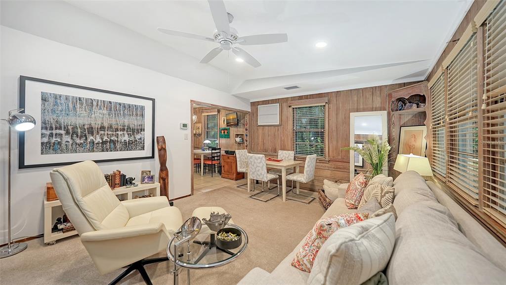 1702 Hillview Street Sarasota, FL 34239 - Photo 12 of 67 a living room with furniture and a large window