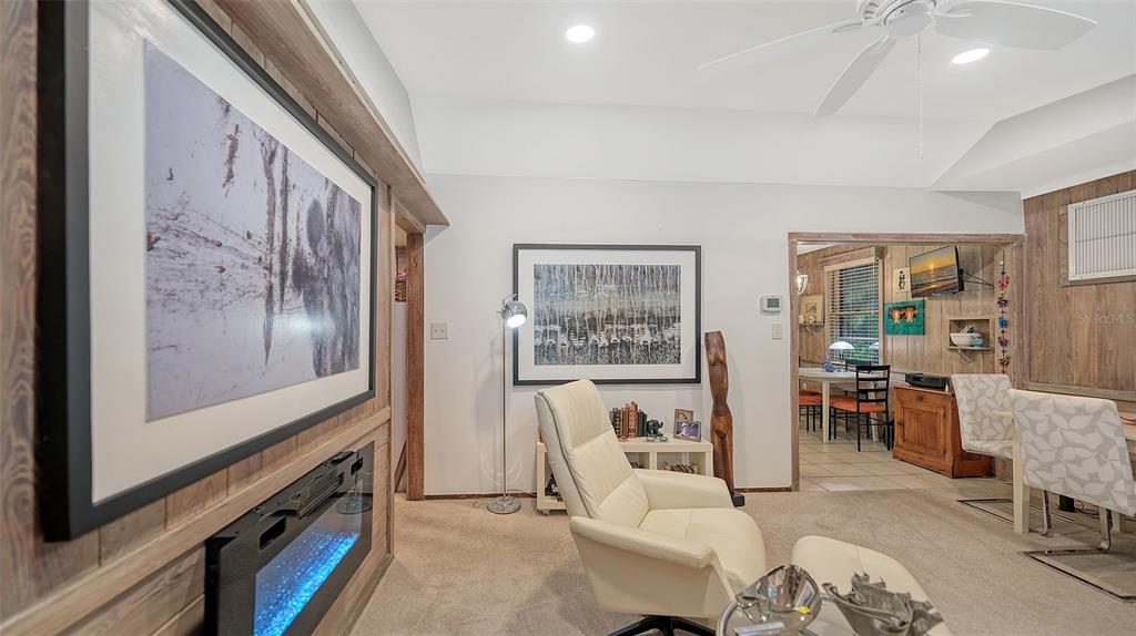 1702 Hillview Street Sarasota, FL 34239 - Photo 13 of 67 a living room with furniture and a flat screen tv