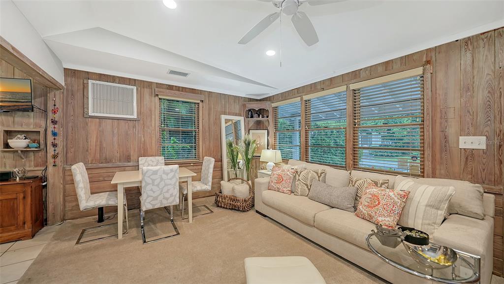 1702 Hillview Street Sarasota, FL 34239 - Photo 14 of 67 a living room with furniture and a large window