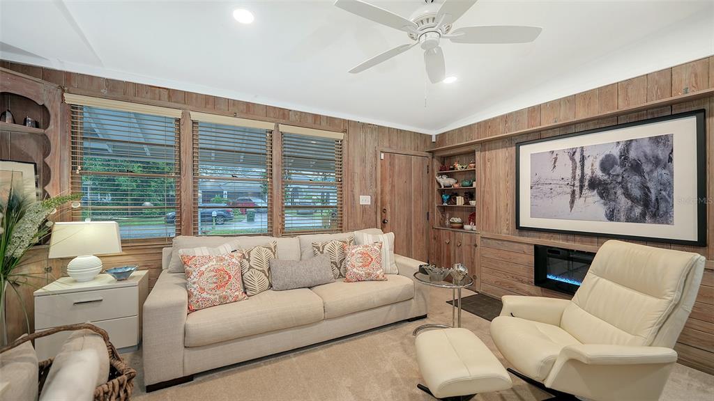 1702 Hillview Street Sarasota, FL 34239 - Photo 16 of 67 a living room with furniture and a large window