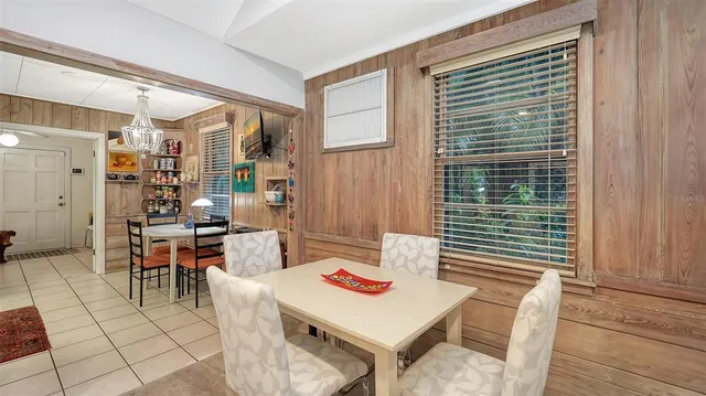 a view of a dining room with furniture window and outside view