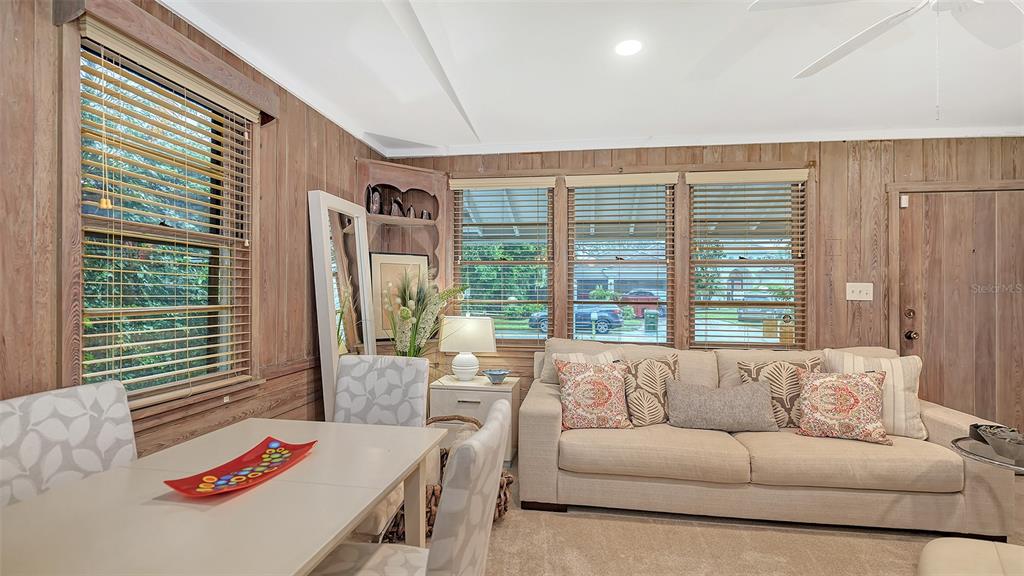 1702 Hillview Street Sarasota, FL 34239 - Photo 20 of 67 a living room with furniture and a large window