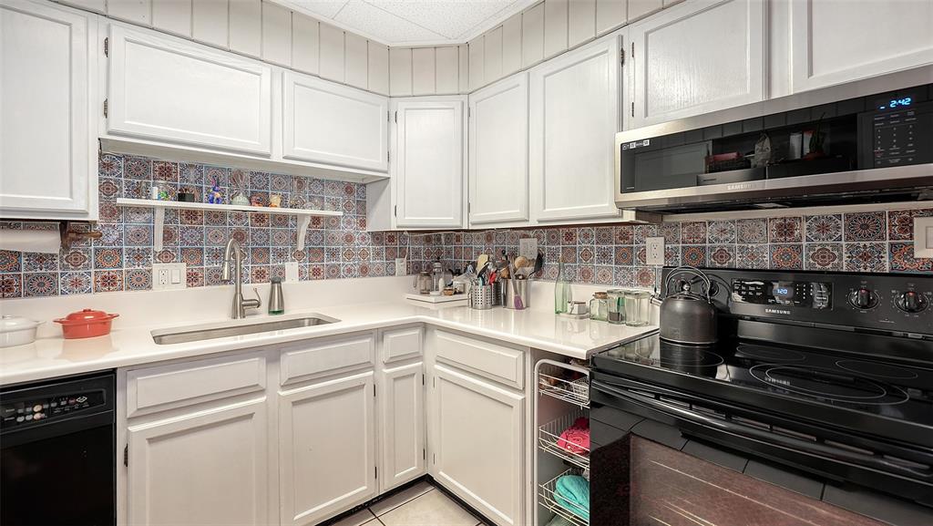 1702 Hillview Street Sarasota, FL 34239 - Photo 25 of 67 a kitchen with appliances a sink and cabinets