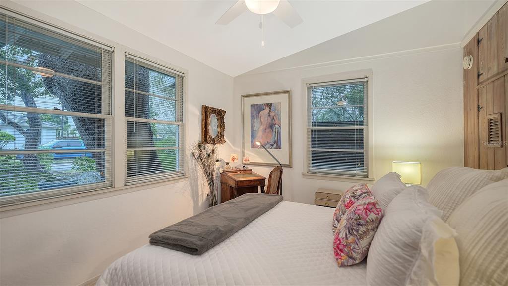 1702 Hillview Street Sarasota, FL 34239 - Photo 27 of 67 a bedroom with a bed and wooden floor