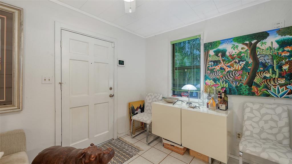 1702 Hillview Street Sarasota, FL 34239 - Photo 30 of 67 a room that has a bed and a window in it