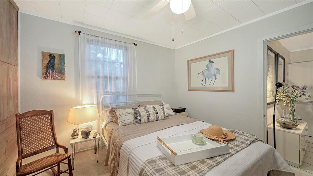 1702 Hillview Street Sarasota, FL 34239 - Photo 35 of 67 a bedroom with a bed and wooden floor