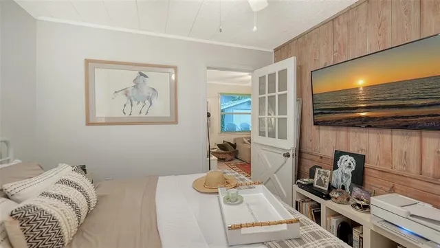 a view of house with yard and sitting area