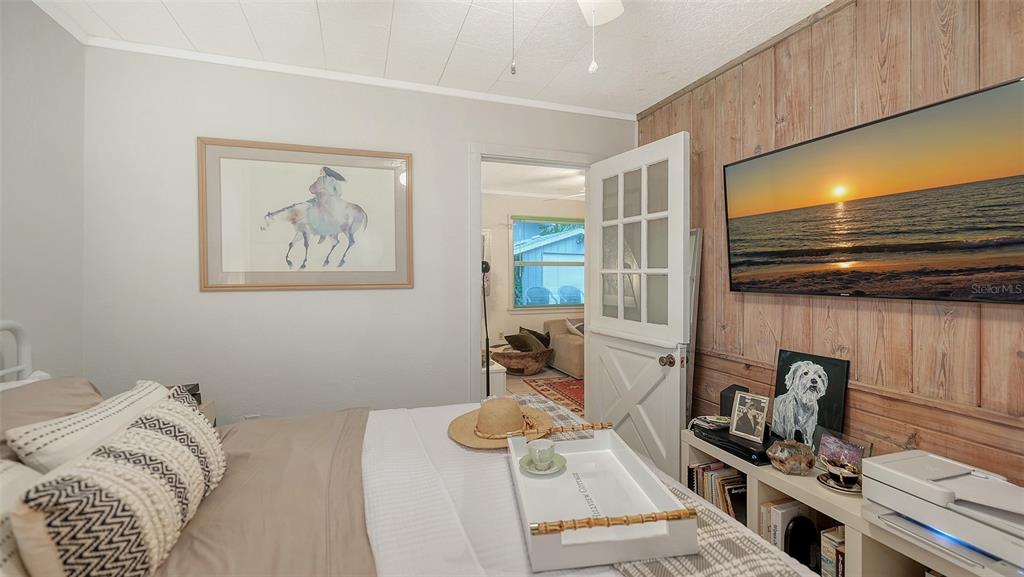1702 Hillview Street Sarasota, FL 34239 - Photo 37 of 67 a bedroom with a bed and wooden floor