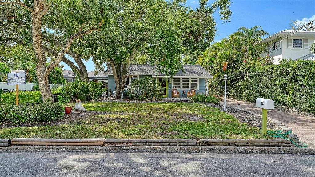 1702 Hillview Street Sarasota, FL 34239 - Photo 43 of 67 a front view of a house with a garden