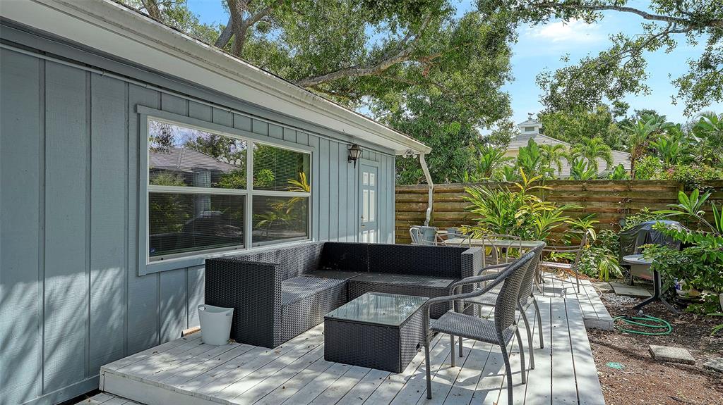 1702 Hillview Street Sarasota, FL 34239 - Photo 47 of 67 a backyard of a house with table and chairs