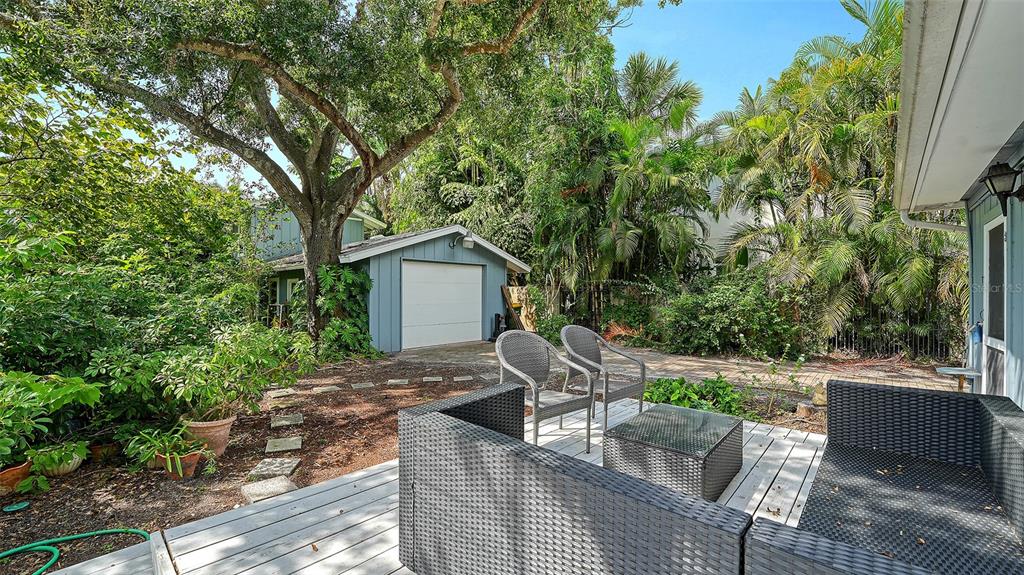 1702 Hillview Street Sarasota, FL 34239 - Photo 48 of 67 a view of backyard with outdoor seating and green space