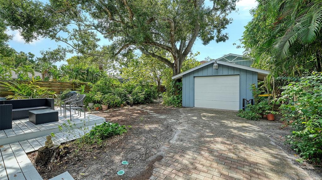 1702 Hillview Street Sarasota, FL 34239 - Photo 50 of 67 a view of a house with a yard and tree s