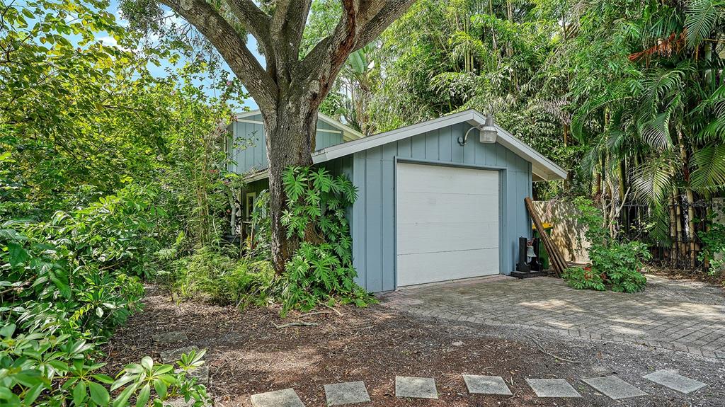 1702 Hillview Street Sarasota, FL 34239 - Photo 51 of 67 a view of a house with a tree in the background