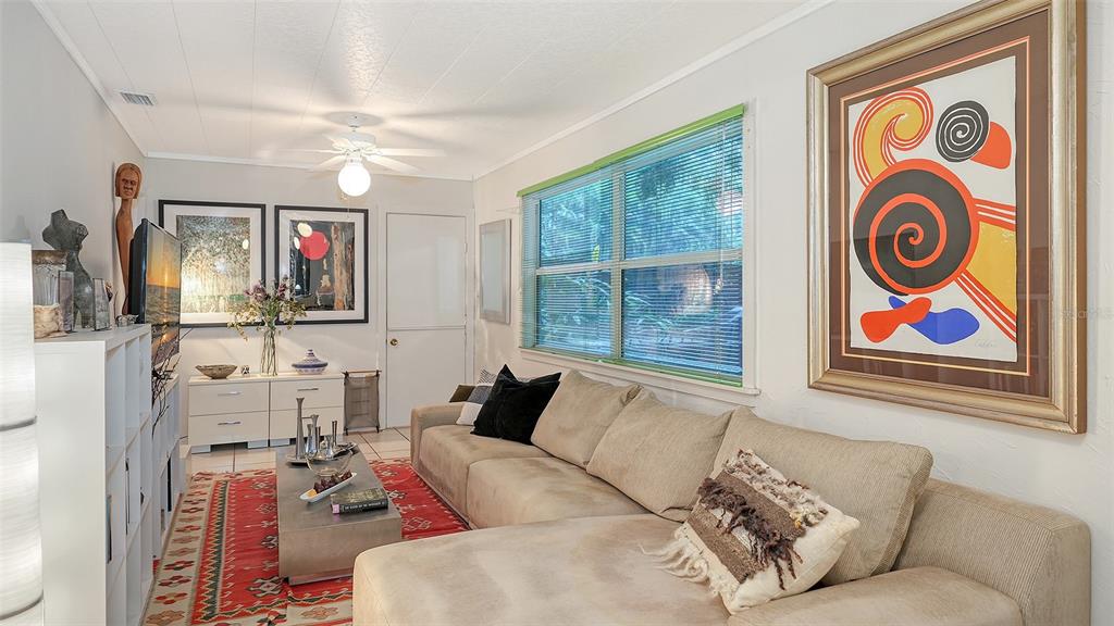 1702 Hillview Street Sarasota, FL 34239 - Photo 7 of 67 a living room with furniture and a flat screen tv