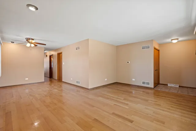 a view of a livingroom with wooden floor