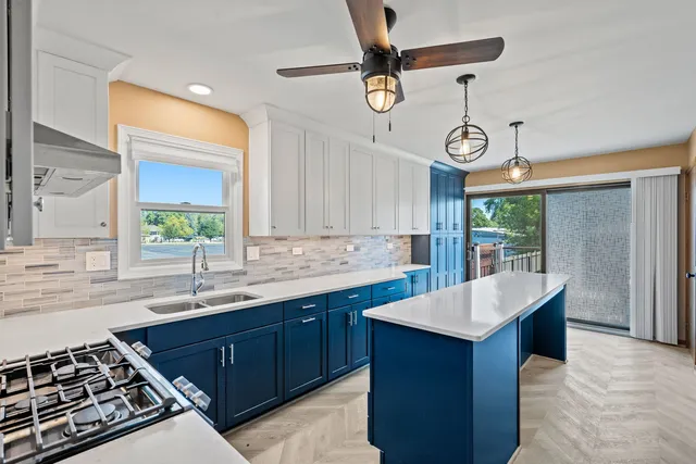 a kitchen with a sink and a stove