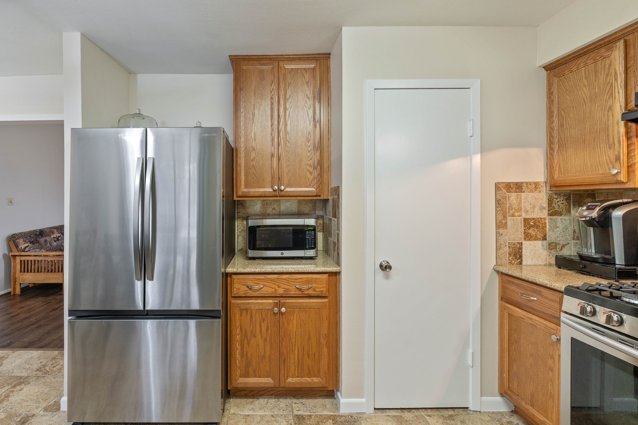 23019 Rothwood Road Spring, TX 77389 - Photo 12 of 30 a kitchen with stainless steel appliances a refrigerator stove and microwave
