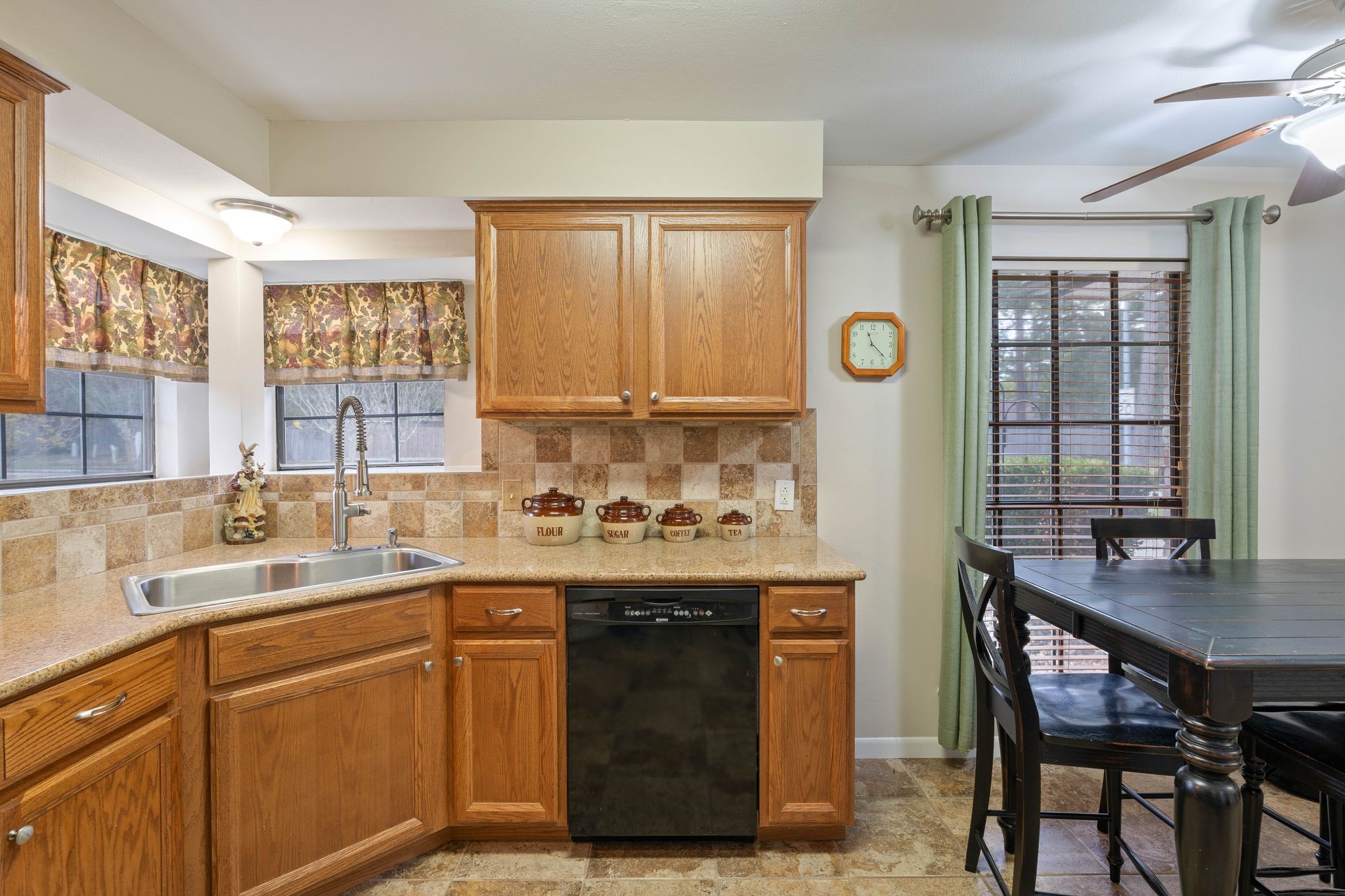 23019 Rothwood Road Spring, TX 77389 - Photo 13 of 30 a kitchen with a sink stove and cabinets