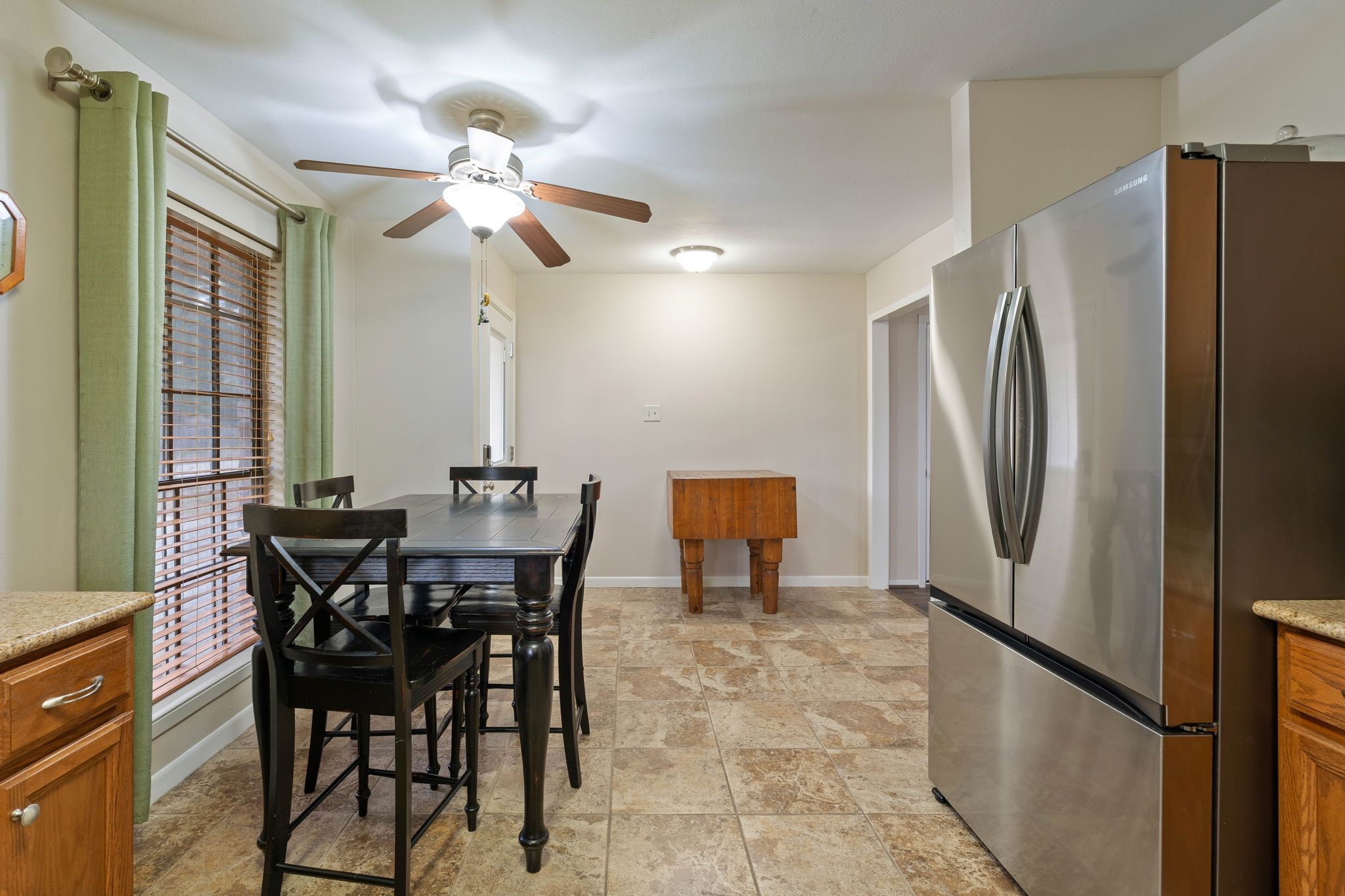 23019 Rothwood Road Spring, TX 77389 - Photo 14 of 30 a view of a dining room with furniture window and wooden floor