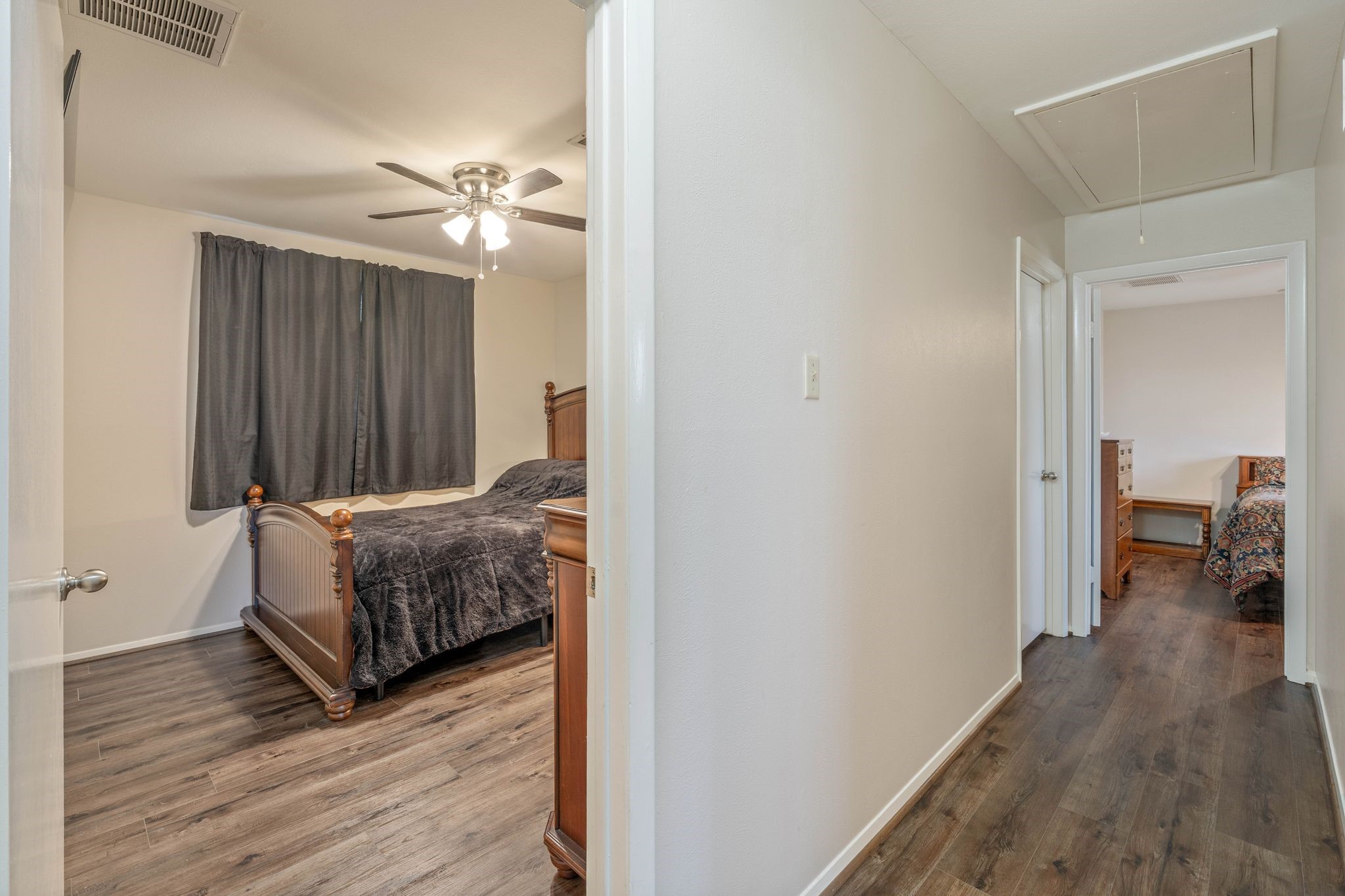23019 Rothwood Road Spring, TX 77389 - Photo 20 of 30 a living room with a bed furniture and a wooden floor