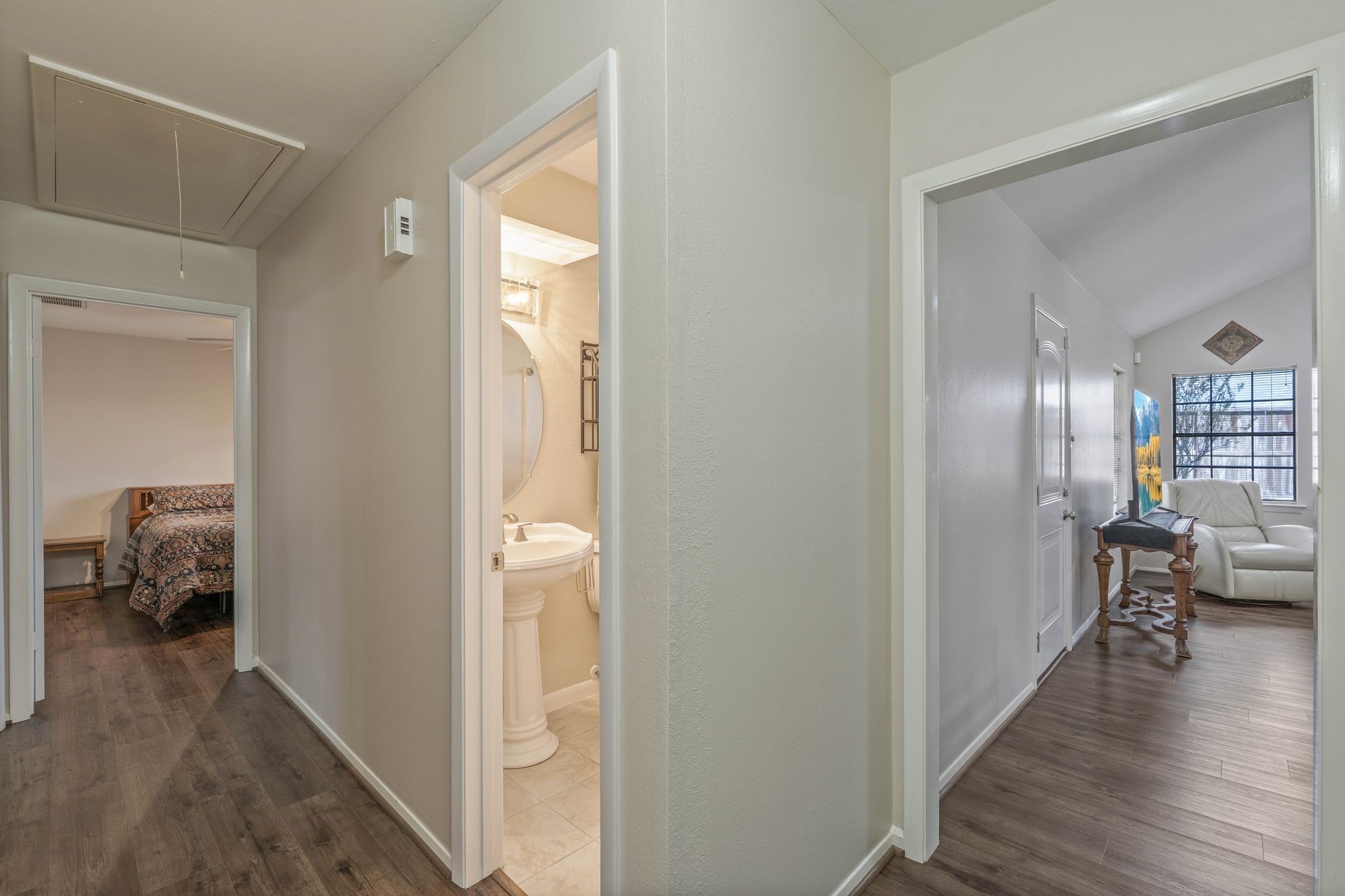 23019 Rothwood Road Spring, TX 77389 - Photo 24 of 30 a view of a hallway and wooden floor and livingroom with furniture