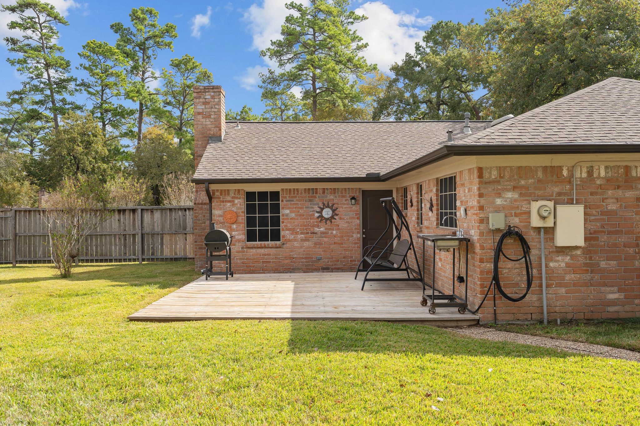 23019 Rothwood Road Spring, TX 77389 - Photo 27 of 30 a view of a house with a swimming pool
