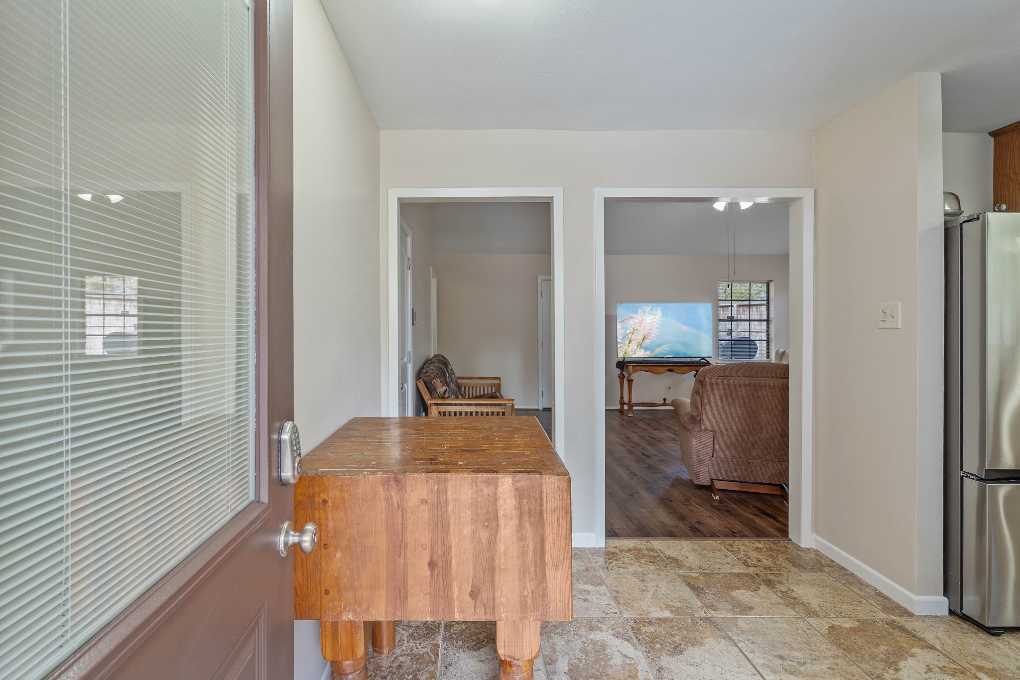 23019 Rothwood Road Spring, TX 77389 - Photo 5 of 30 a bedroom with a bed and glass door