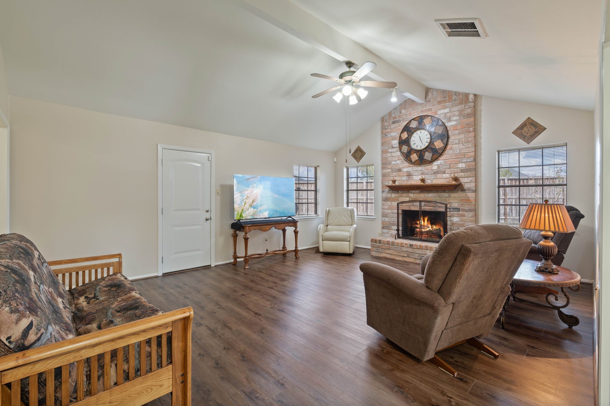23019 Rothwood Road Spring, TX 77389 - Photo 6 of 30 a living room with furniture and a fireplace