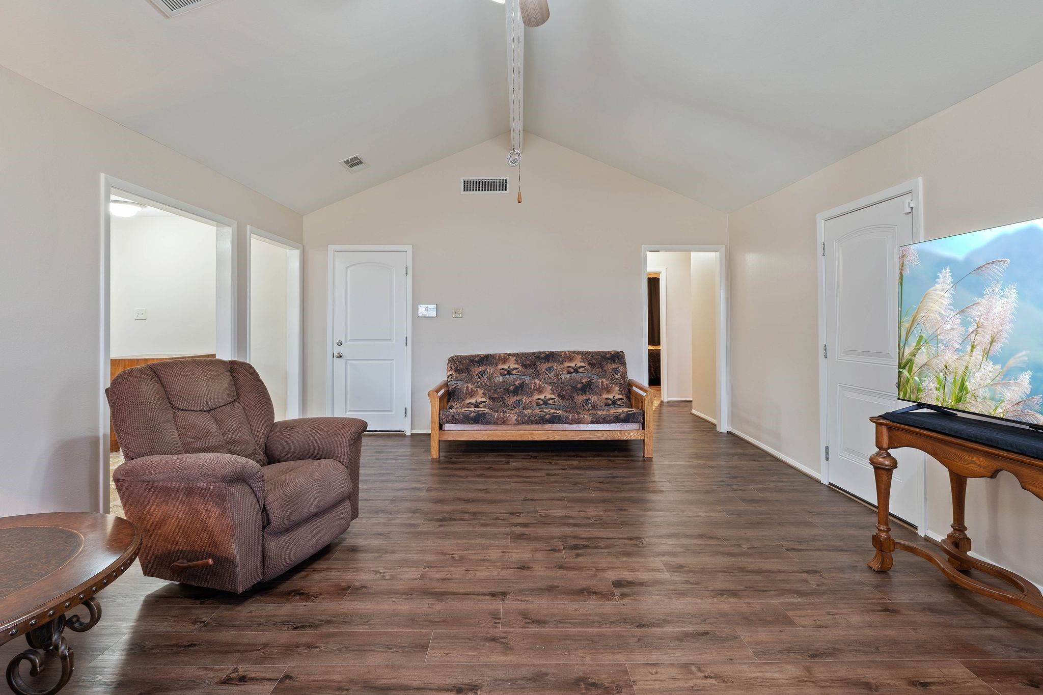 23019 Rothwood Road Spring, TX 77389 - Photo 8 of 30 a living room with furniture and a flat screen tv
