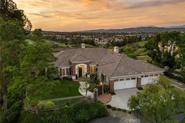 an aerial view of a house with a garden