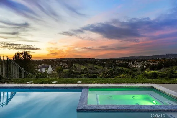 a view of swimming pool with a back yard