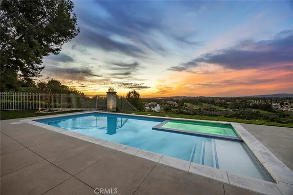 a view of swimming pool with seating area