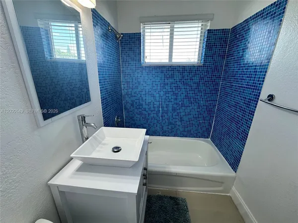 a bathroom with a sink and a toilet