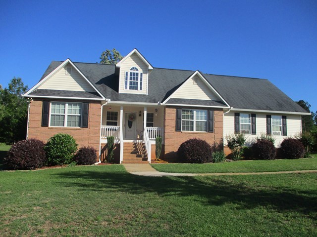116 Nealys Way Haddock, GA 31033 - Photo 1 of 20 a front view of a house with a yard