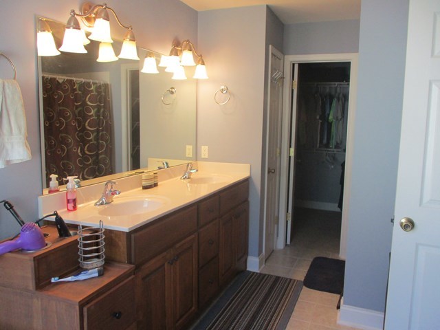 116 Nealys Way Haddock, GA 31033 - Photo 16 of 20 a bathroom with a sink vanity and a mirror