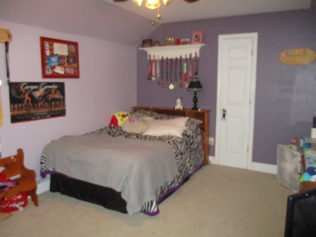 116 Nealys Way Haddock, GA 31033 - Photo 20 of 20 a bedroom with a bed and a chandelier