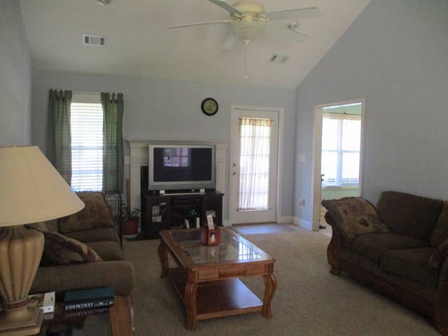 116 Nealys Way Haddock, GA 31033 - Photo 5 of 20 a living room with furniture and a flat screen tv