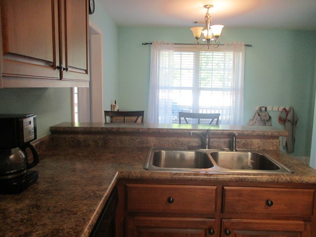 116 Nealys Way Haddock, GA 31033 - Photo 8 of 20 a kitchen with a sink and a window