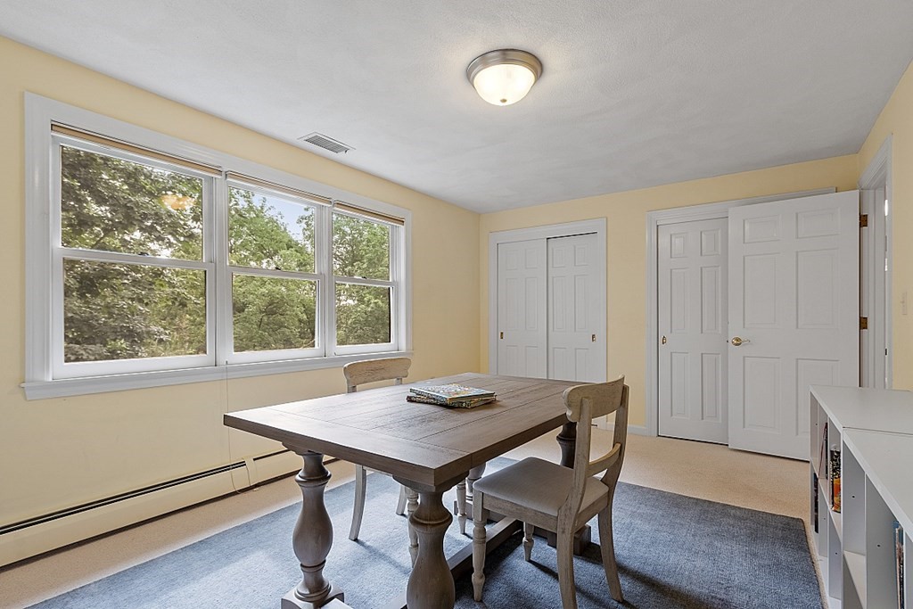2 Sunset Ridge Lexington, MA 02421 - Photo 17 of 39 a view of a dining room with furniture and wooden floor