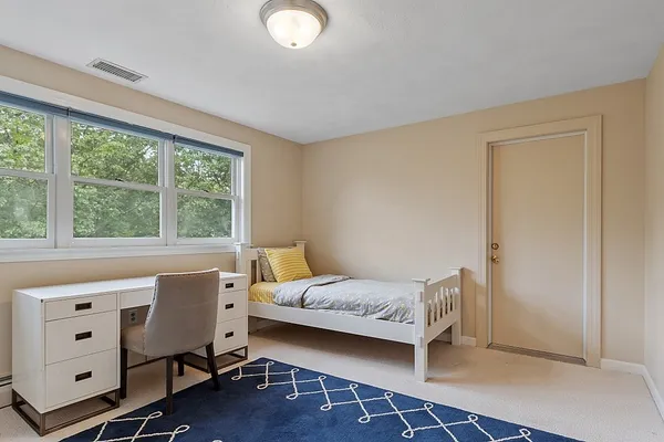 a room with a bed and a window