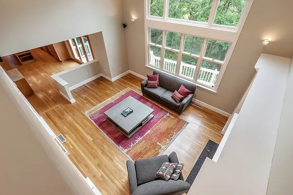 a living room with furniture and a rug