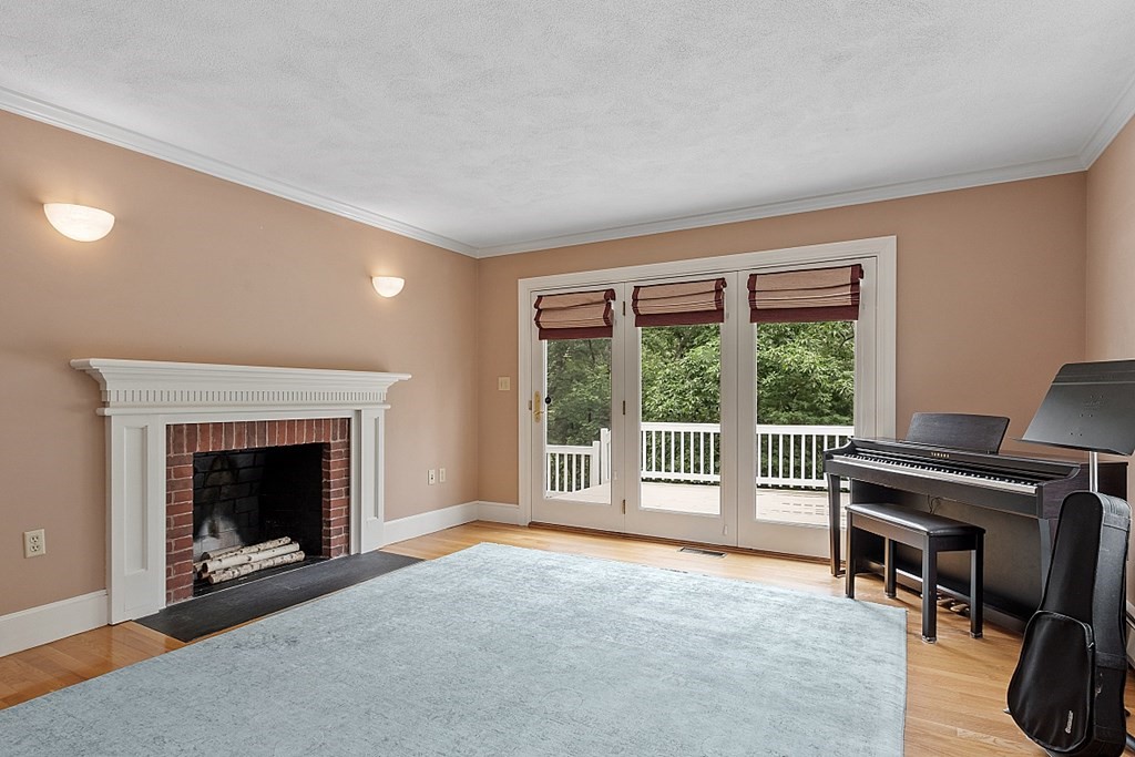 2 Sunset Ridge Lexington, MA 02421 - Photo 28 of 39 a living room with furniture and a fireplace