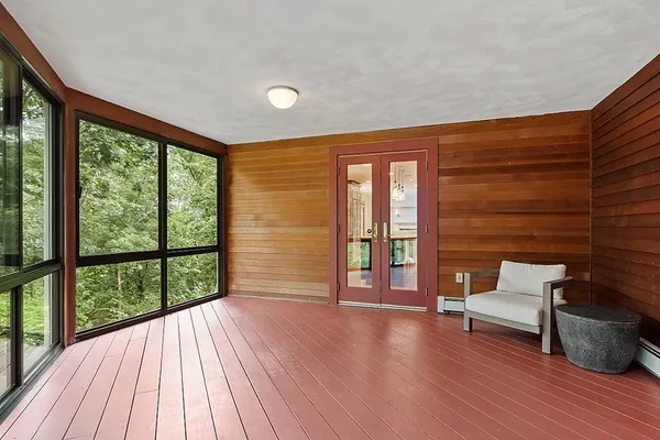 a view of a porch with wooden floor and outdoor space