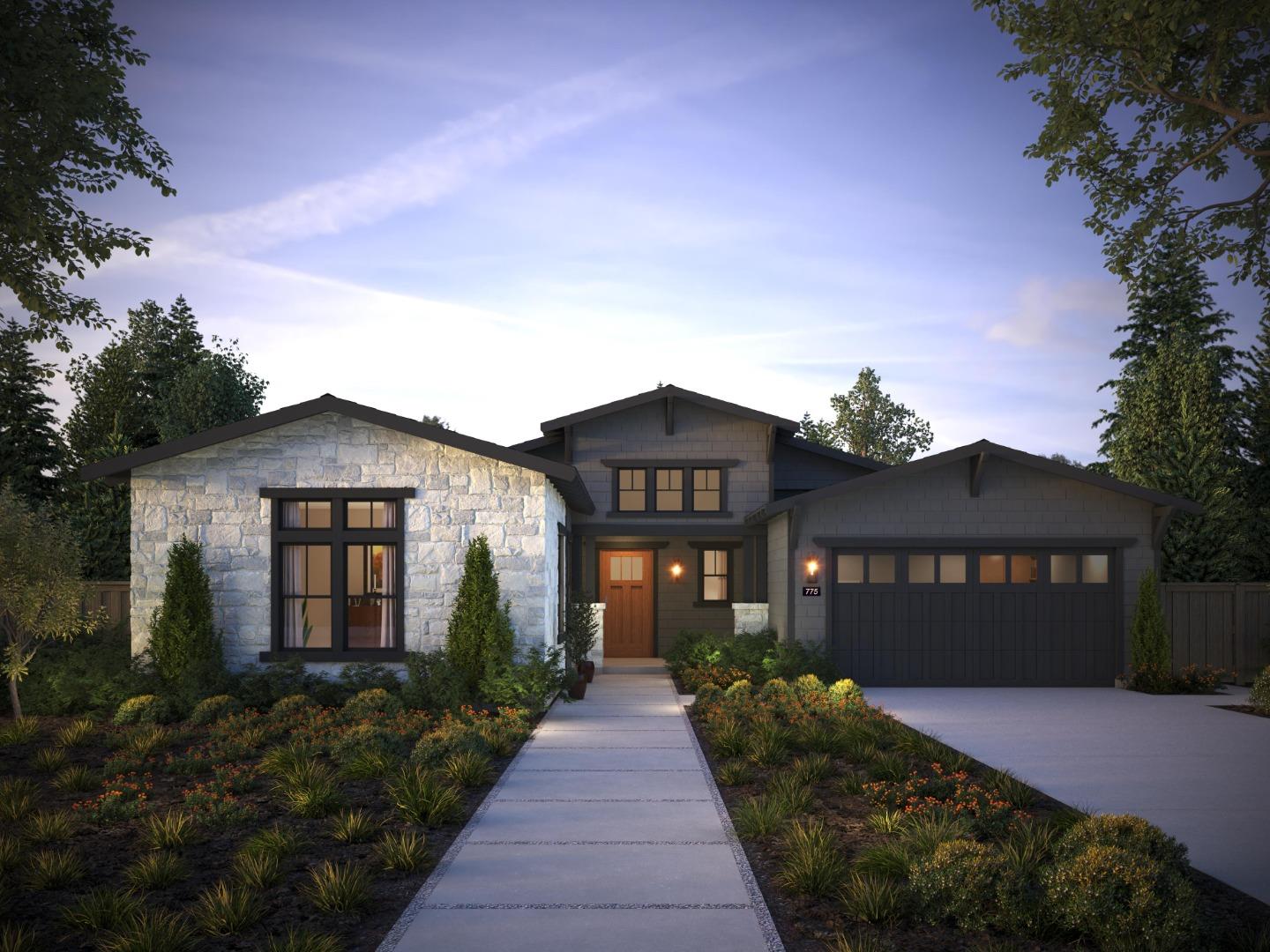 a front view of a house with a yard and potted plants