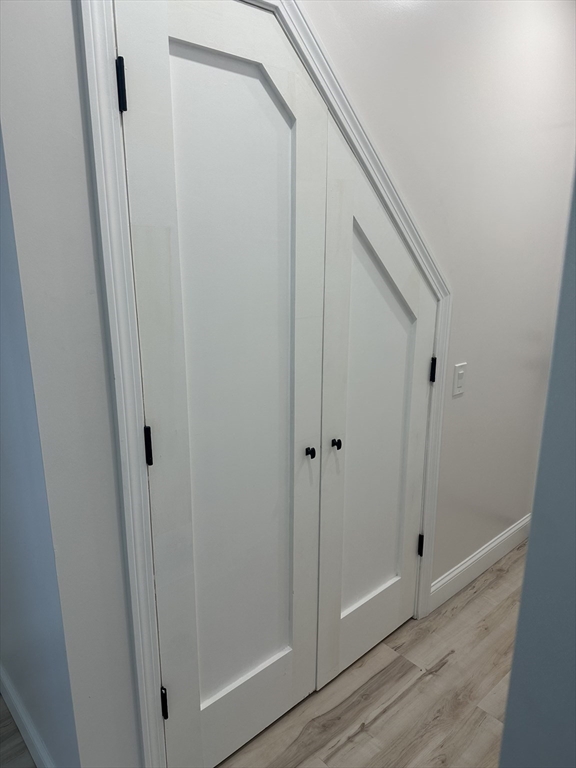 31 Old Morton Street, Unit 1 Boston, MA 02126 - Photo 15 of 17 a view of a hallway with wooden floor