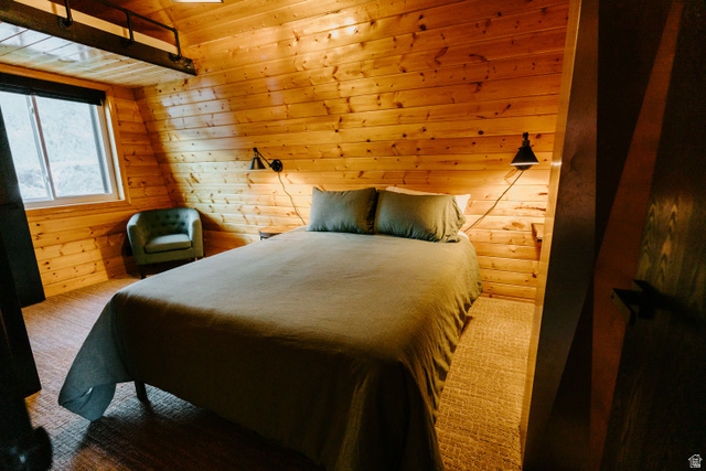 1413 Basel Drive Midway, UT 84049 - Photo 58 of 137 Carpeted bedroom featuring wood walls and a vaulted wooden ceiling